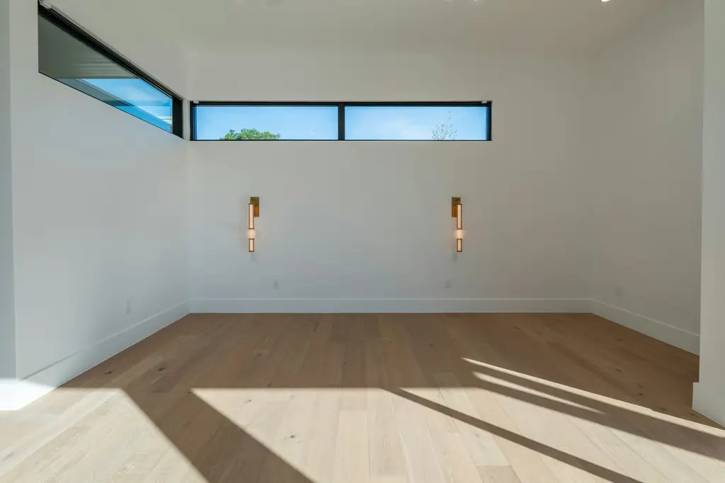 Clean, empty apartment unit with hardwood floors ready for its next resident after a turnover