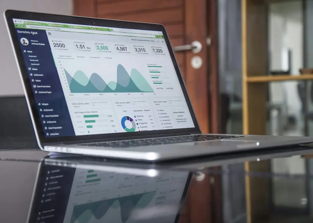 Rental income analytics dashboard on a laptop