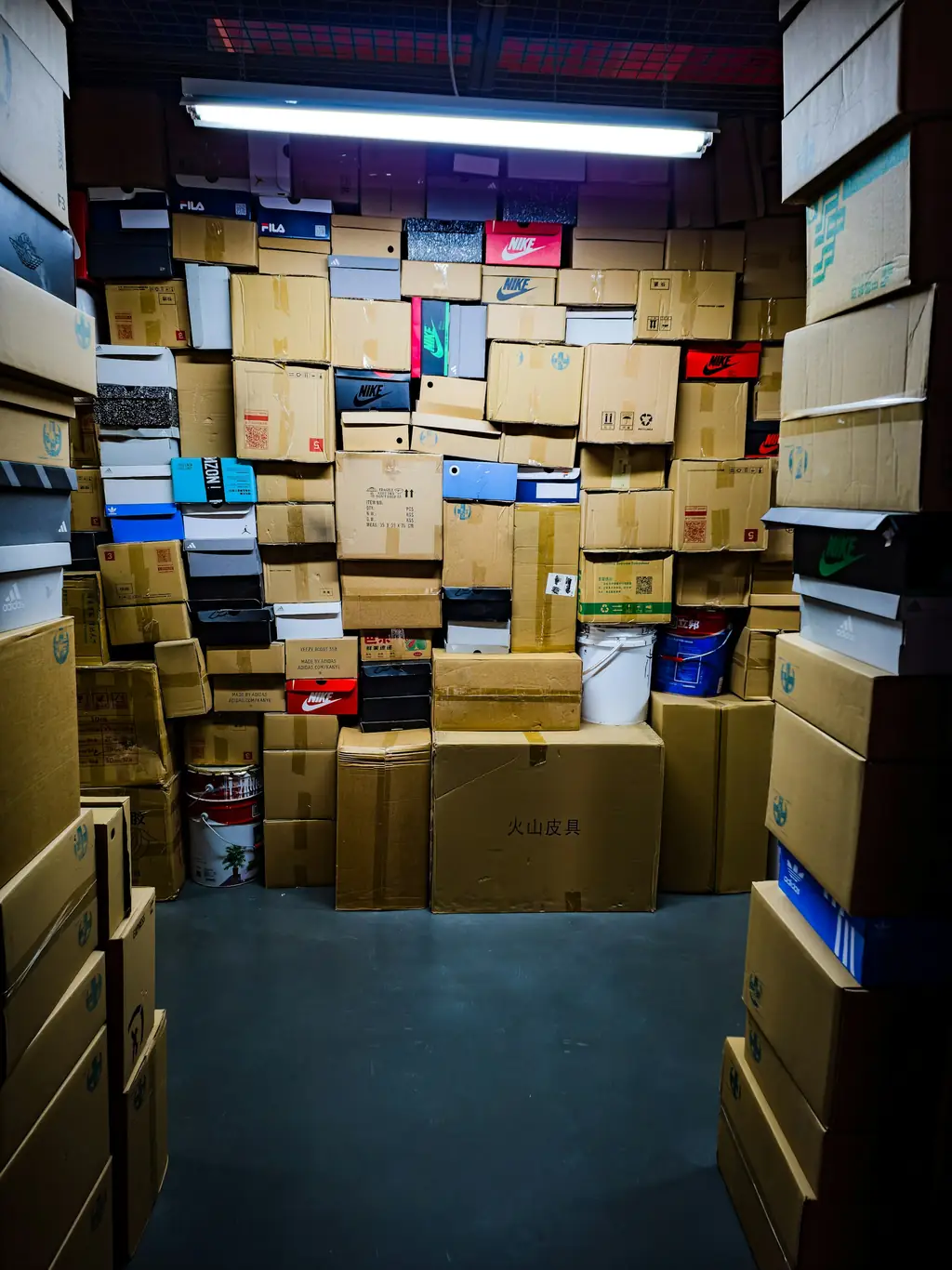 Moving boxes stacked in the living room of a new rental home